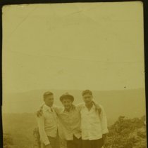Three men posing for the camera.